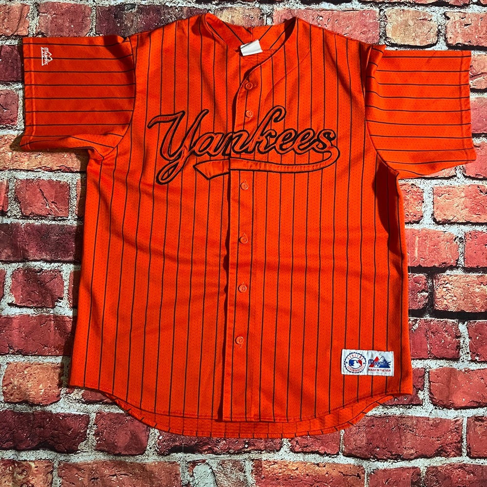 Majestic Orange Baseball Jersey with Pinstripes and Cursive Text